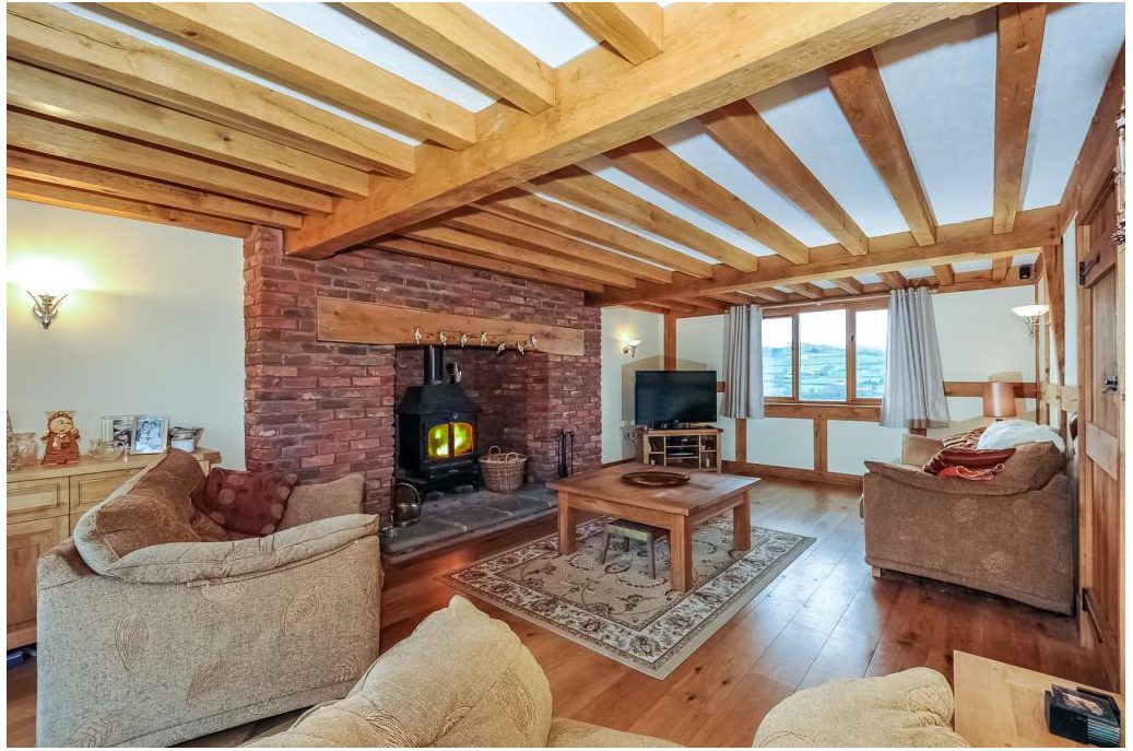 In the living room of a rustic house during the day