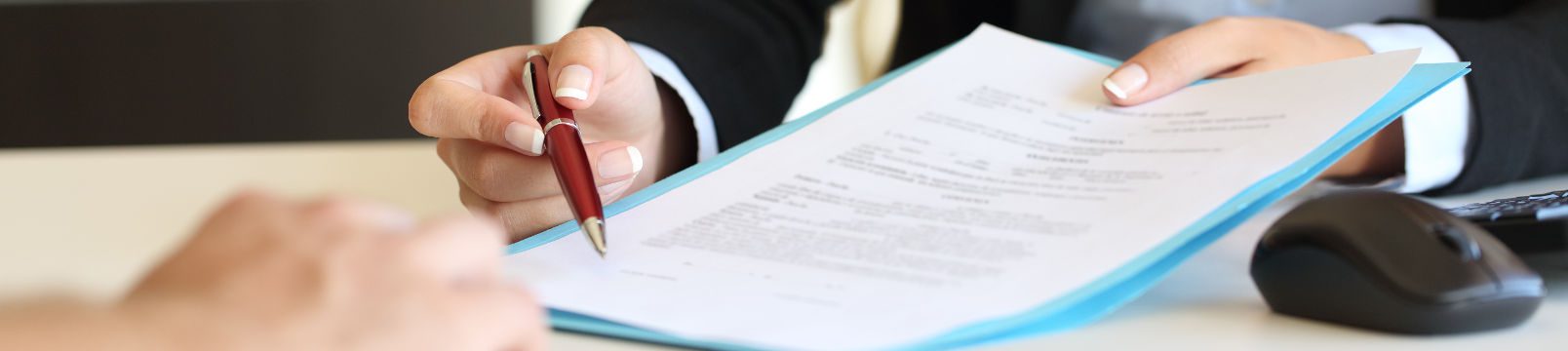 Woman showing document to sign